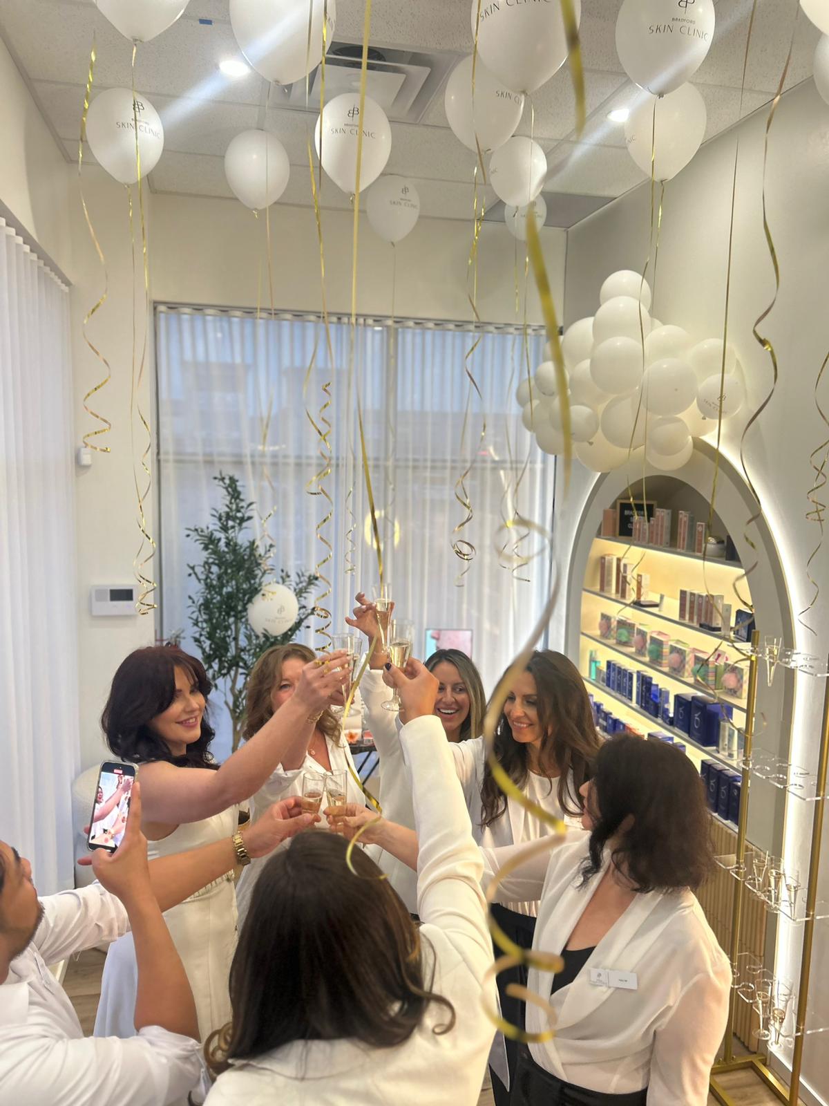 A celebratory champagne toast at the Bradford Skin Clinic