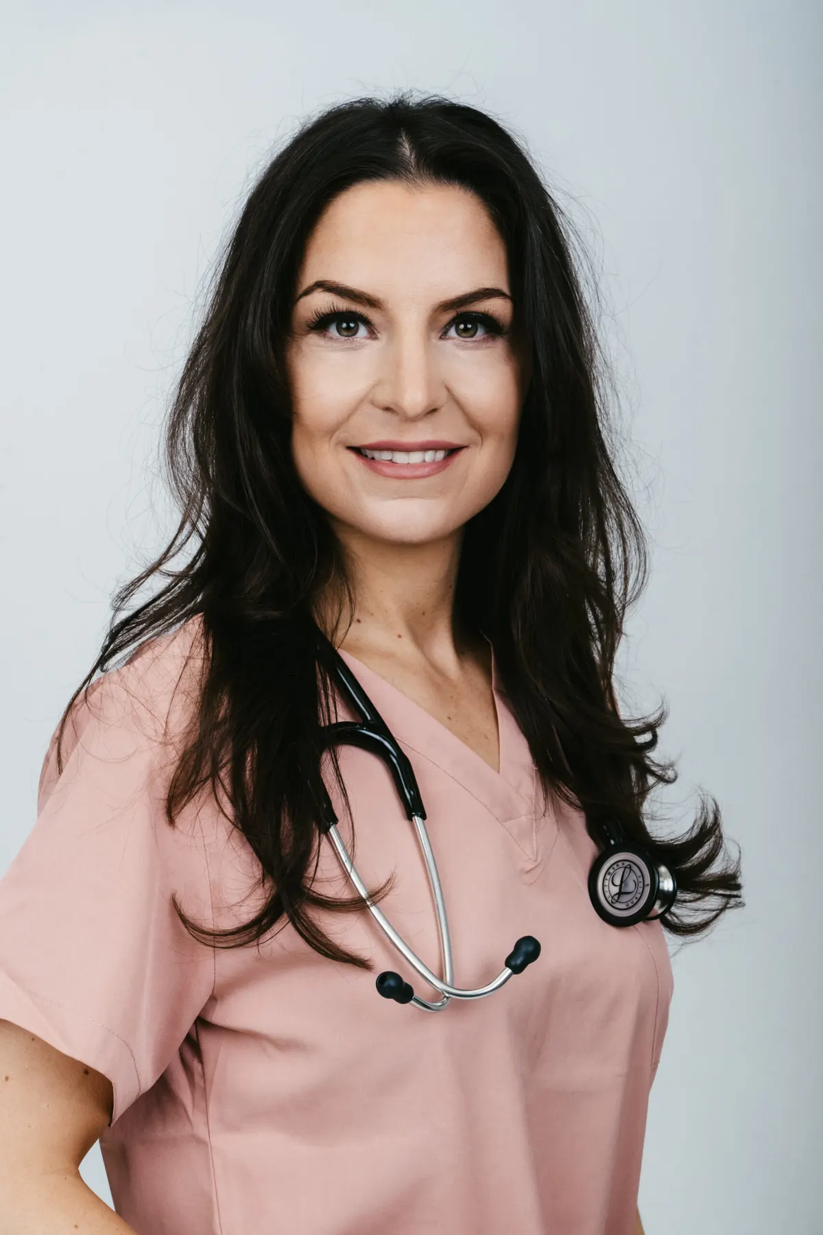 Dr. Erica Vriend in navy Bradford Skin Clinic scrubs