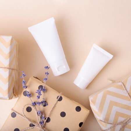 Top view of blank cosmetics tube with gift boxes